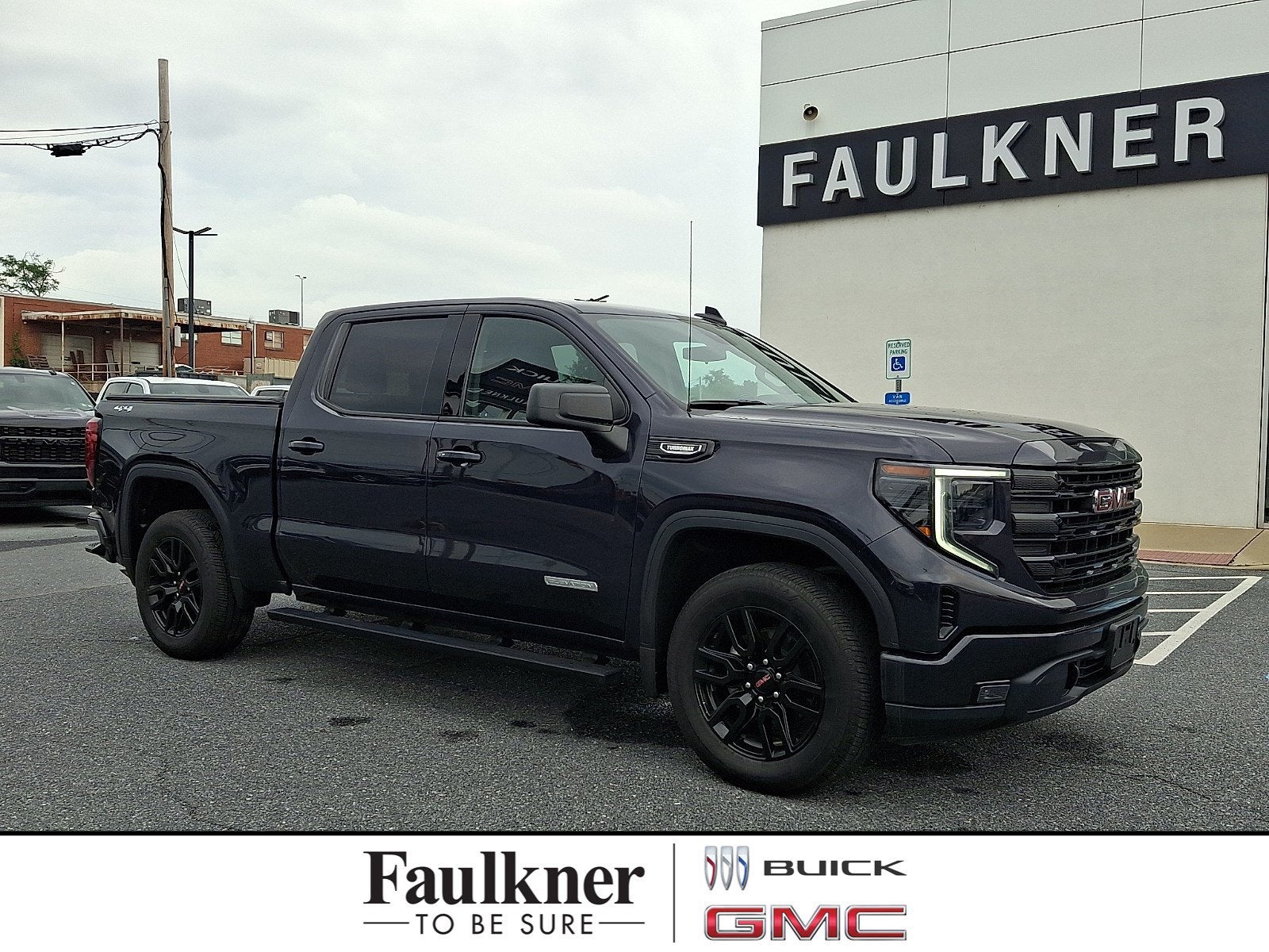 2024 GMC Sierra 1500 Elevation in Titanium Rush Metallic — front three-quarter view