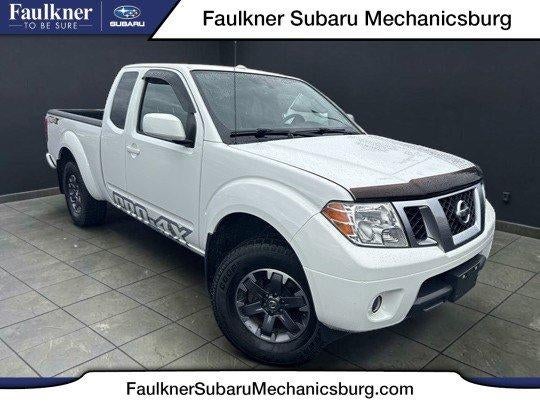 2015 Nissan Frontier 4WD King Cab Auto PRO-4X in Glacier White — front three-quarter view