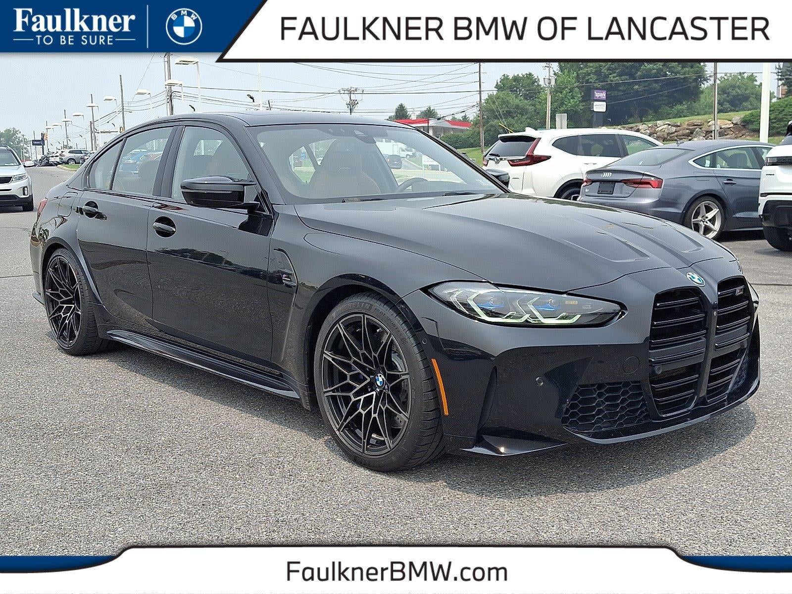 2021 BMW M3 M3 Competition Sedan in Black Sapphire Metallic — front three-quarter view