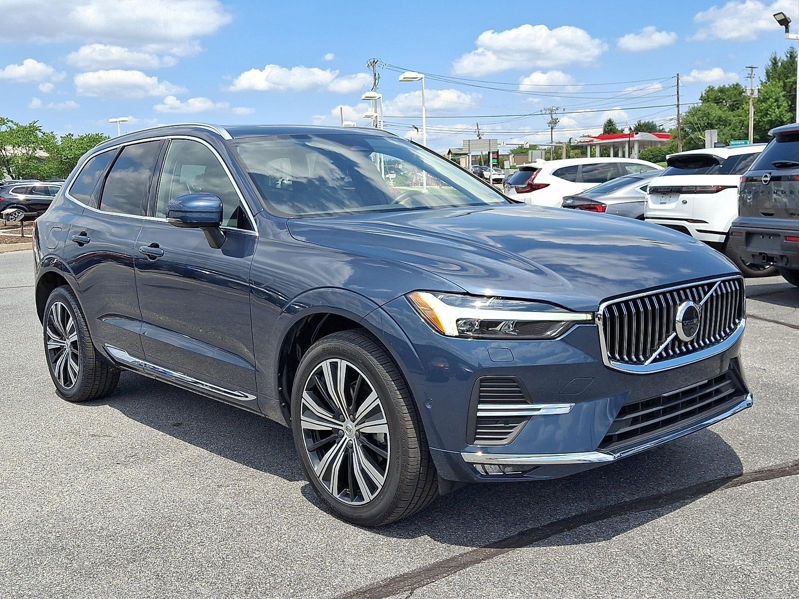 2023 Volvo XC60 B5 AWD Plus Bright Theme in Denim Blue Metallic — front three-quarter view