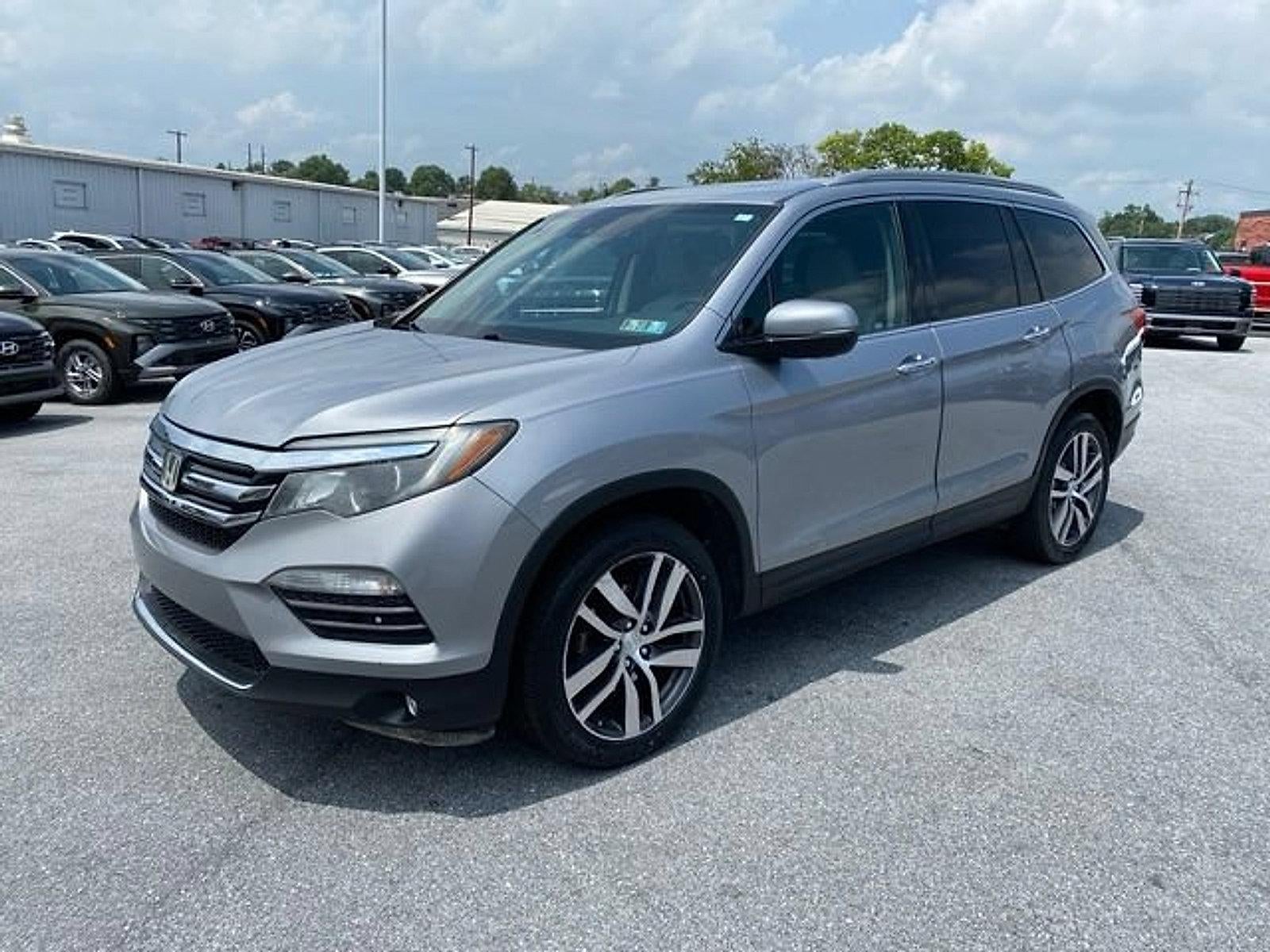 2017 Honda Pilot Elite in Lunar Silver Metallic — front three-quarter view