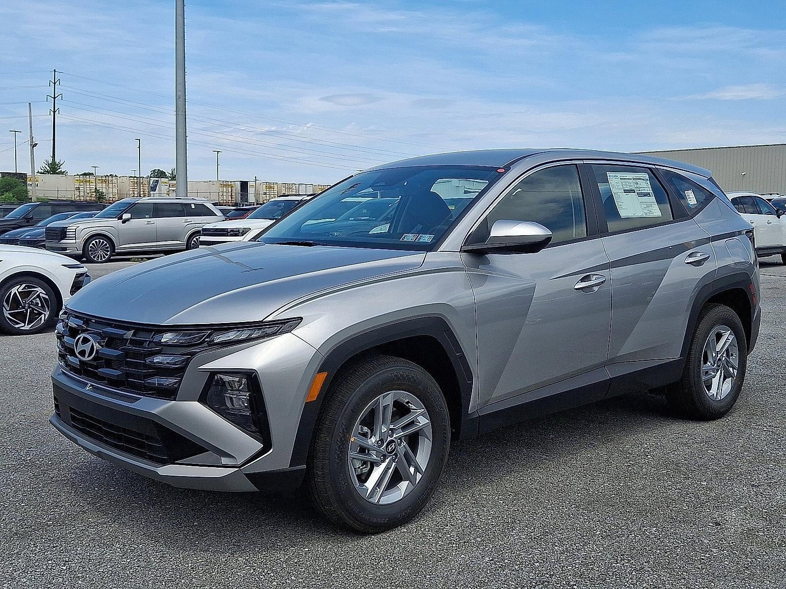 2026 Hyundai TUCSON SE AWD in Shimmering Silver — front three-quarter view