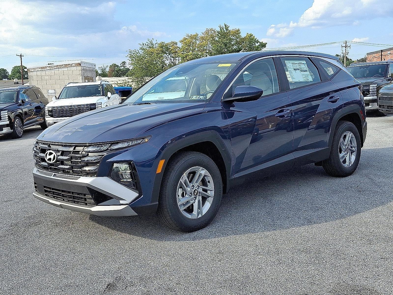 2026 Hyundai TUCSON SE AWD in Atlantis Blue — front three-quarter view