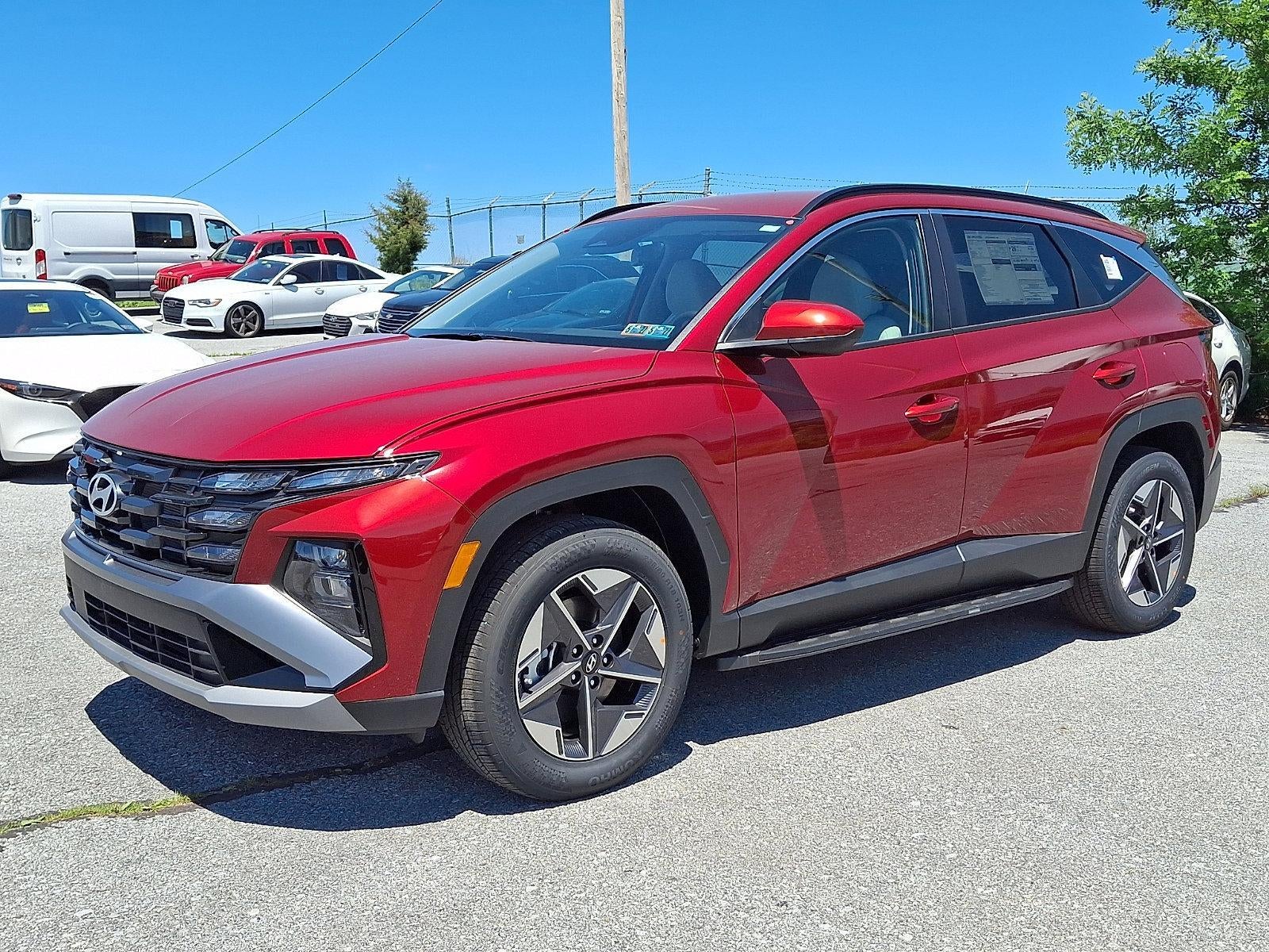 2026 Hyundai TUCSON SEL AWD in Ultimate Red — front three-quarter view