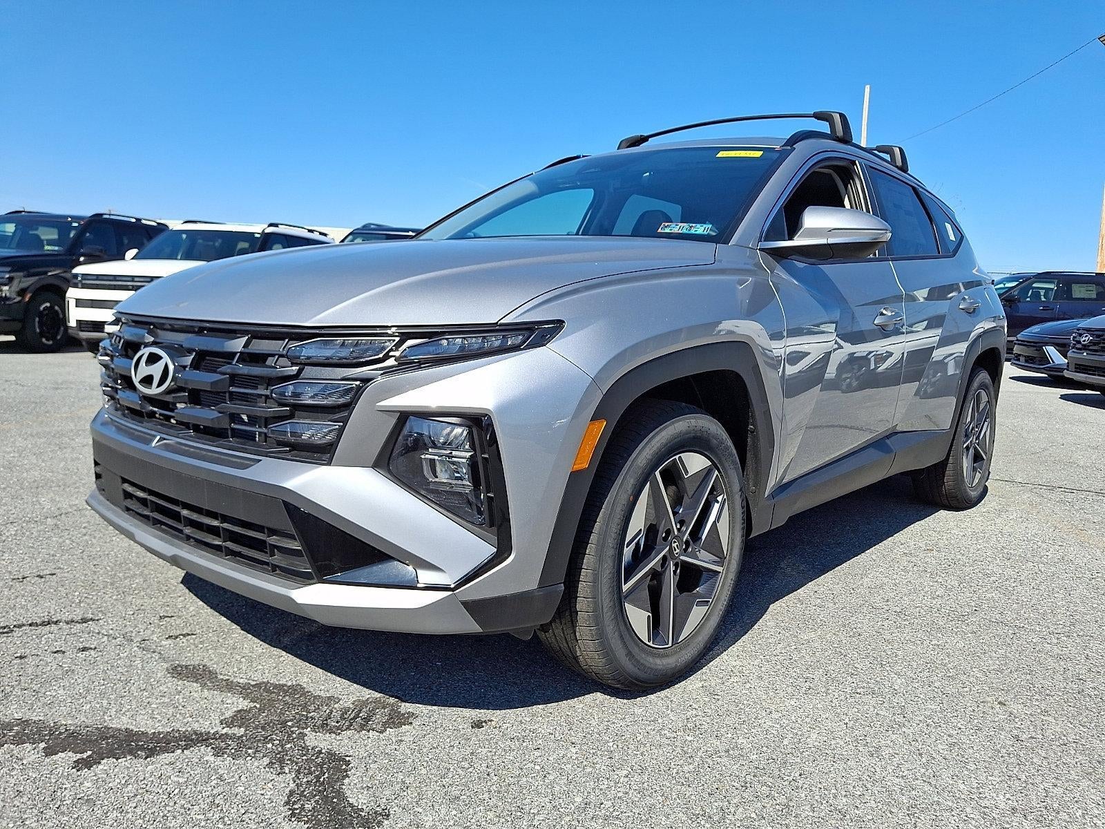 2026 Hyundai TUCSON SEL Premium AWD in Shimmering Silver — front three-quarter view