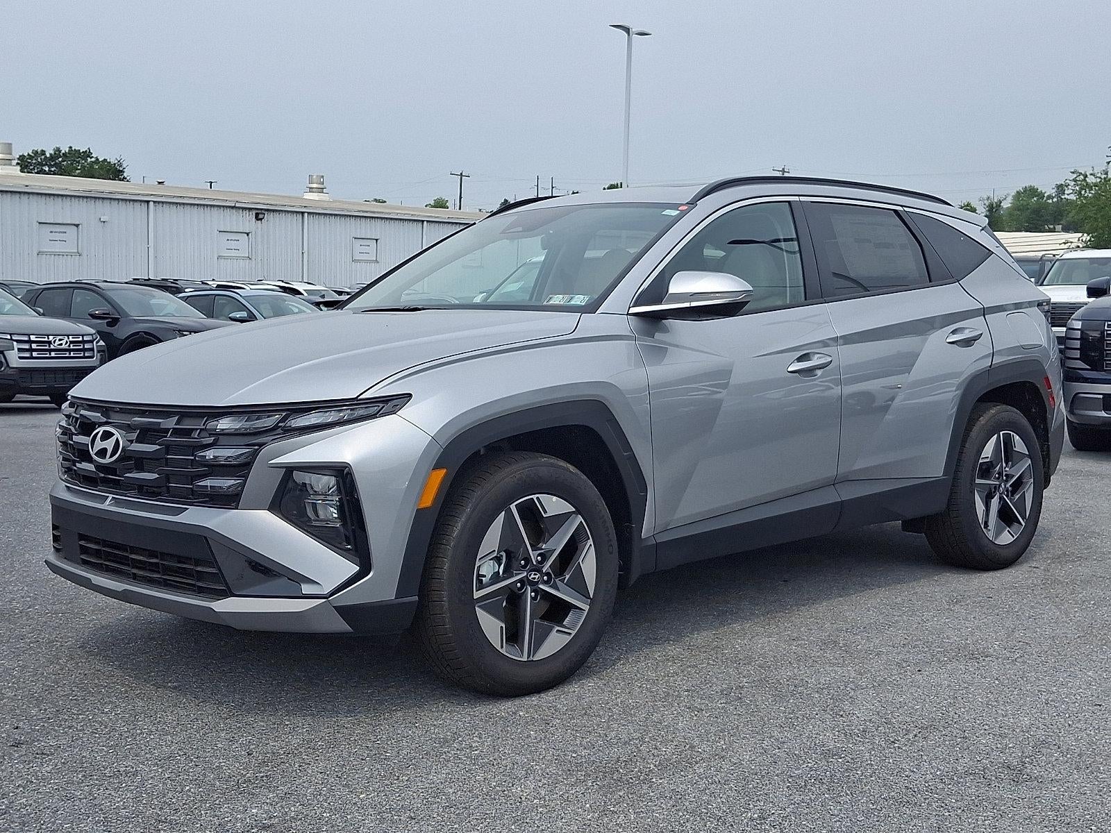 2026 Hyundai TUCSON SEL Premium in Shimmering Silver — front three-quarter view