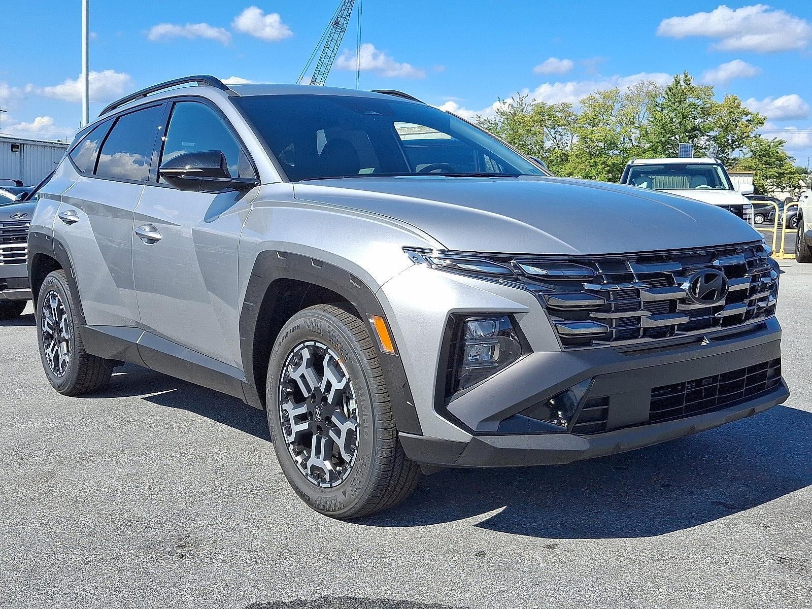 2026 Hyundai TUCSON XRT AWD in Shimmering Silver — front three-quarter view