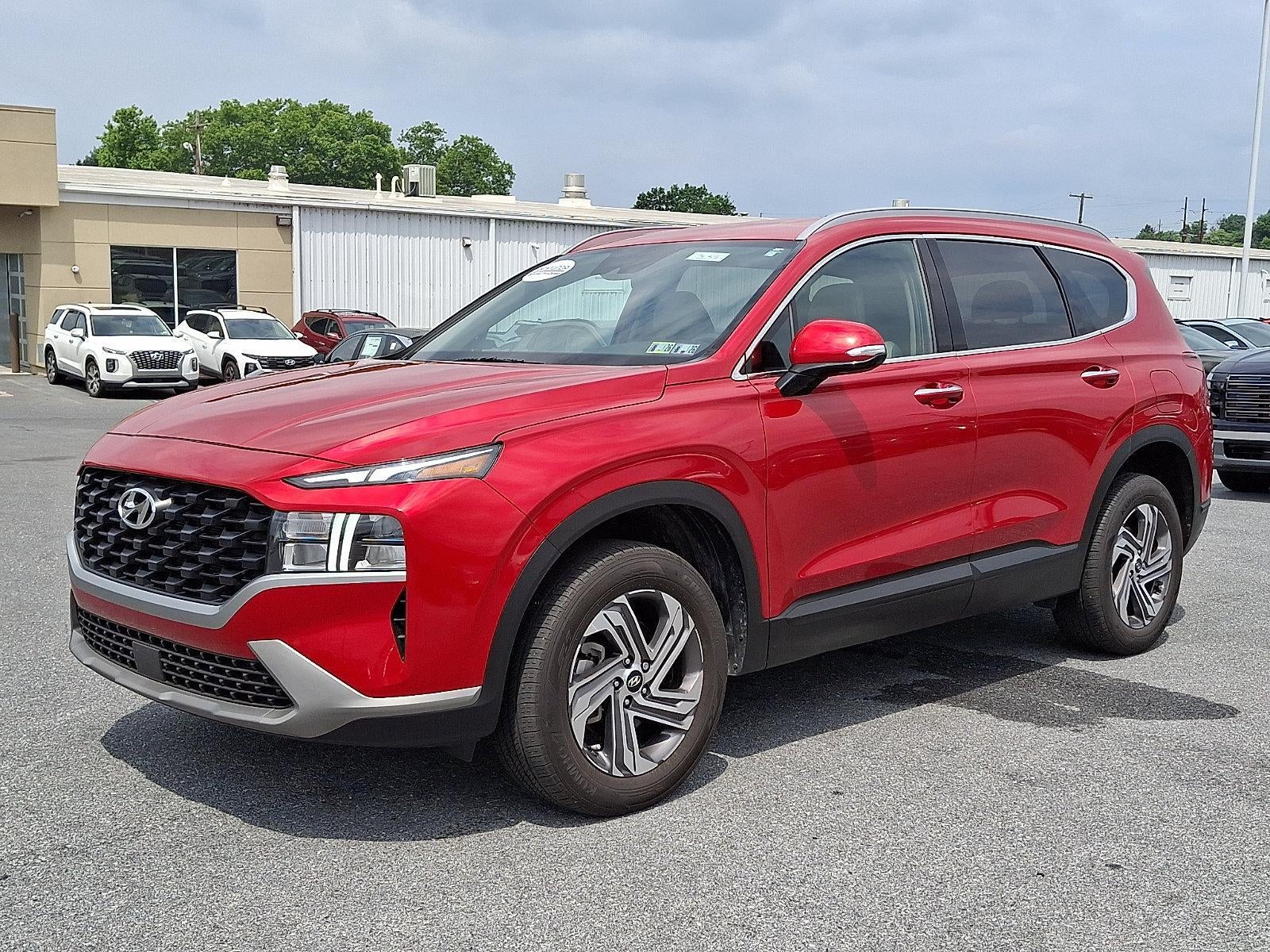 2023 Hyundai SANTA FE SEL in Calypso Red — front three-quarter view