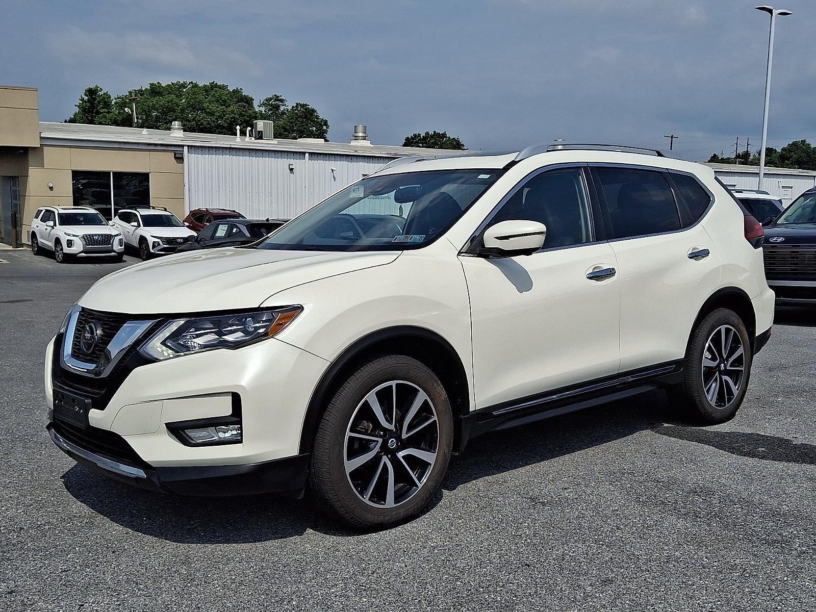 2018 Nissan Rogue SL in Pearl White — front three-quarter view