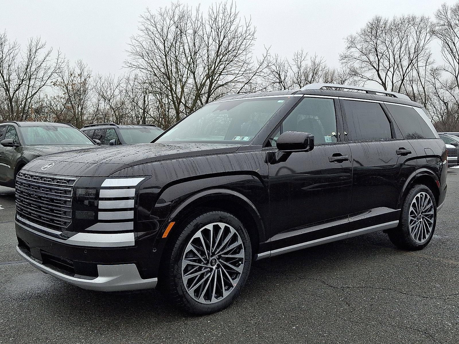 2026 Hyundai PALISADE Calligraphy AWD in Galaxy Maroon Pearl — front three-quarter view